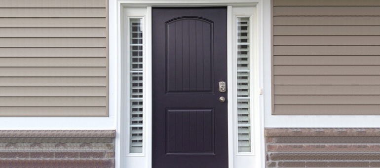 Entry Door Sidelight Shutters Next To Black Door In St. George, UT